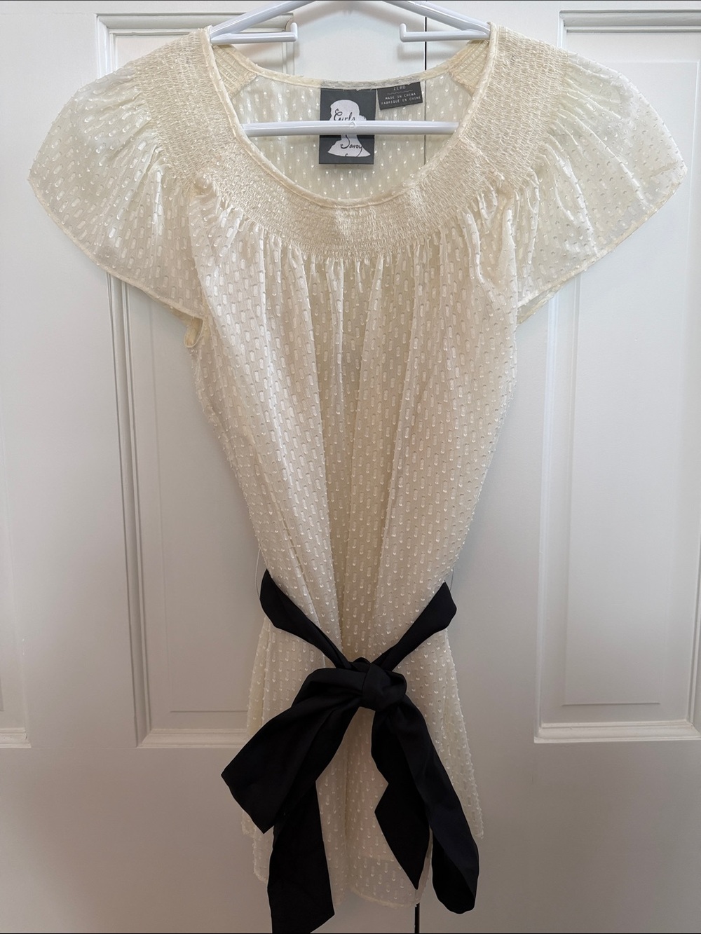 Anthropologie Ivory Swiss Dot Smocked Neck Flutter Sleeve Top with Black Tie
